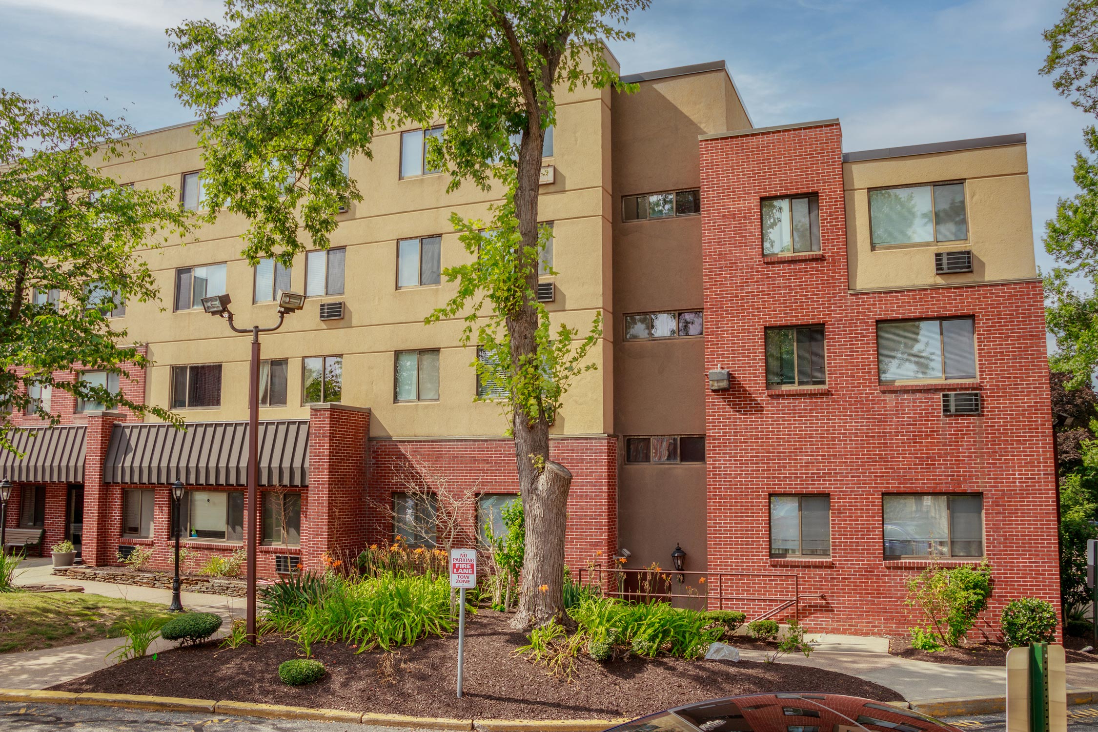 Affordable housing search interface showing community and residential buildings in Massachusetts