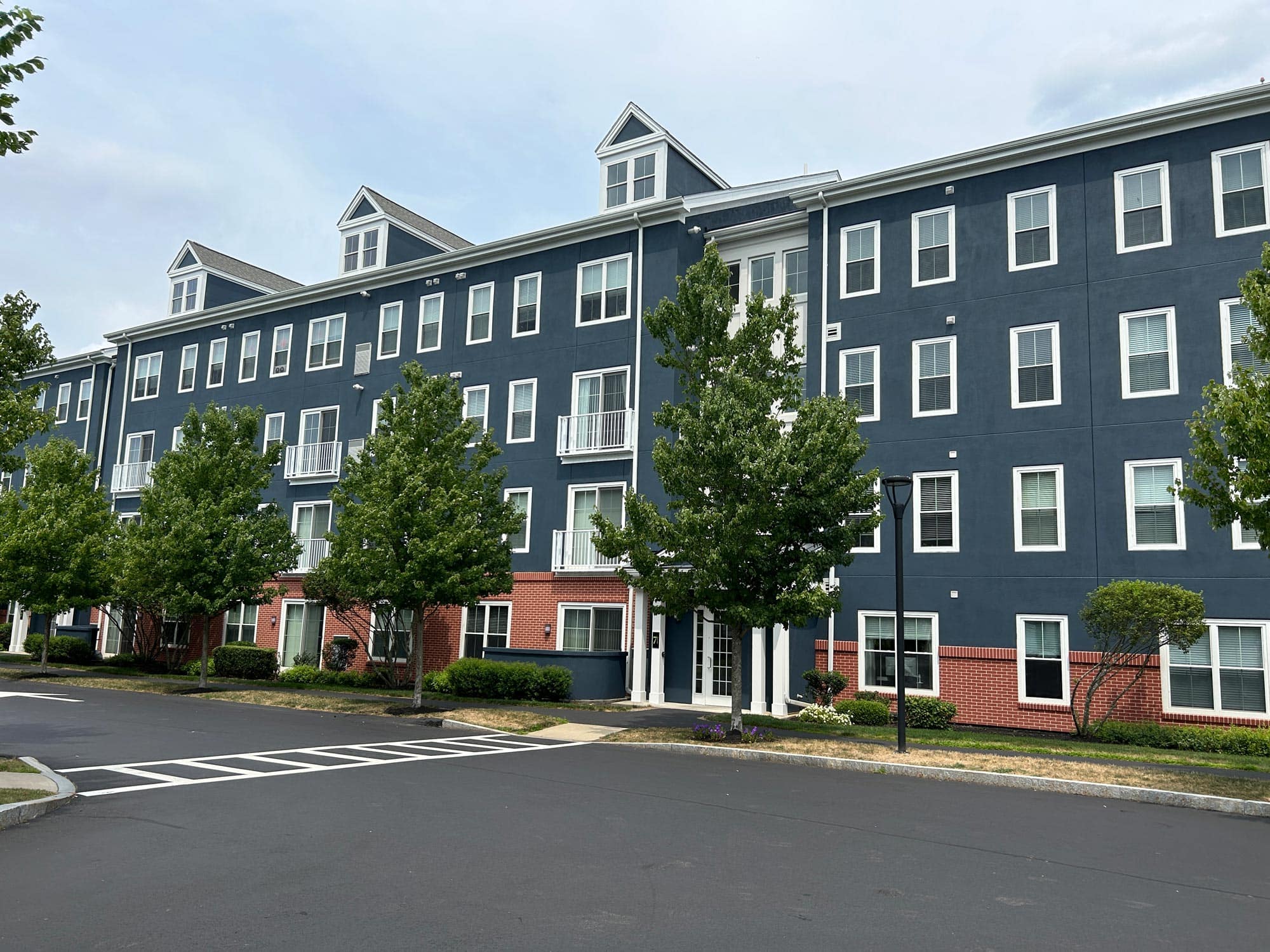 Affordable housing search interface showing community and residential buildings in Massachusetts